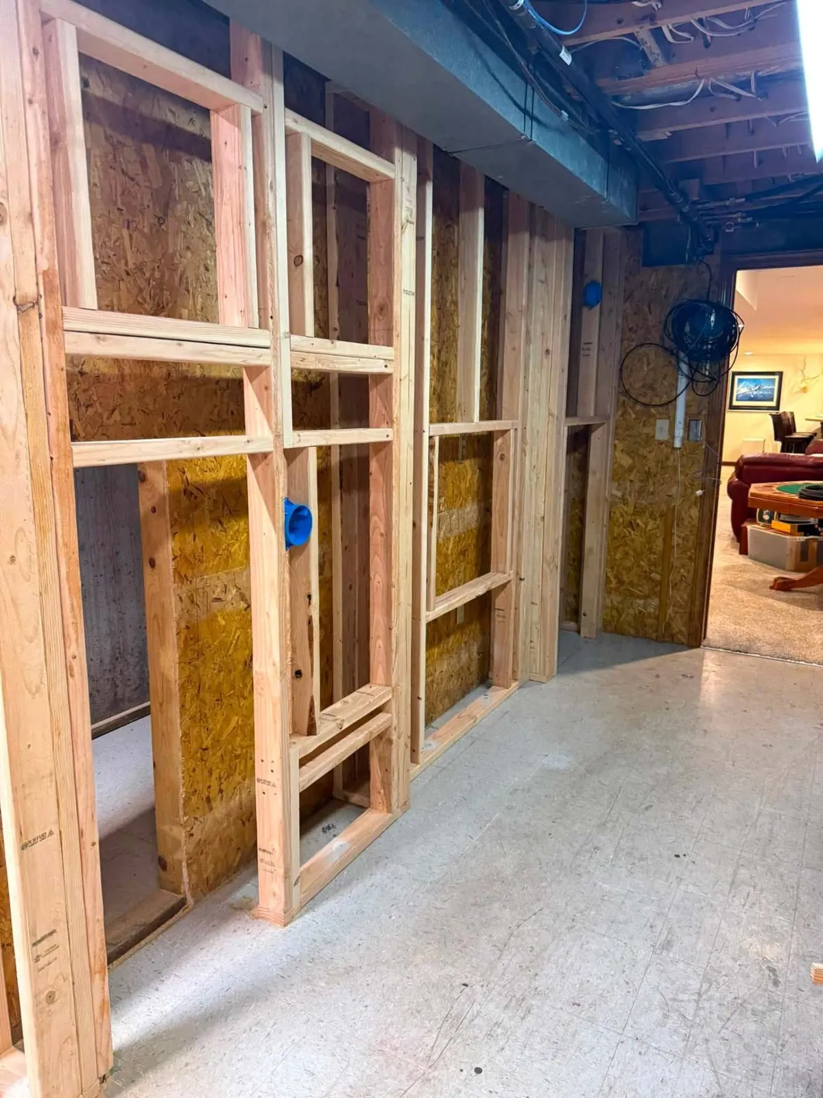 Wood framing under construction for a custom basement children's playhouse