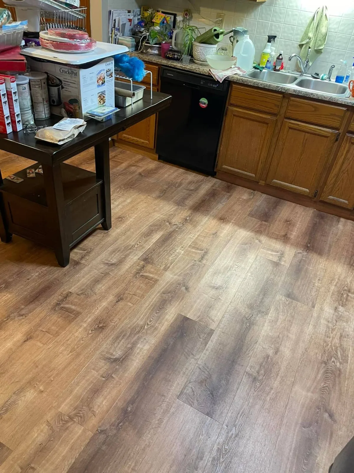 Kitchen after installation of waterproof luxury vinyl flooring